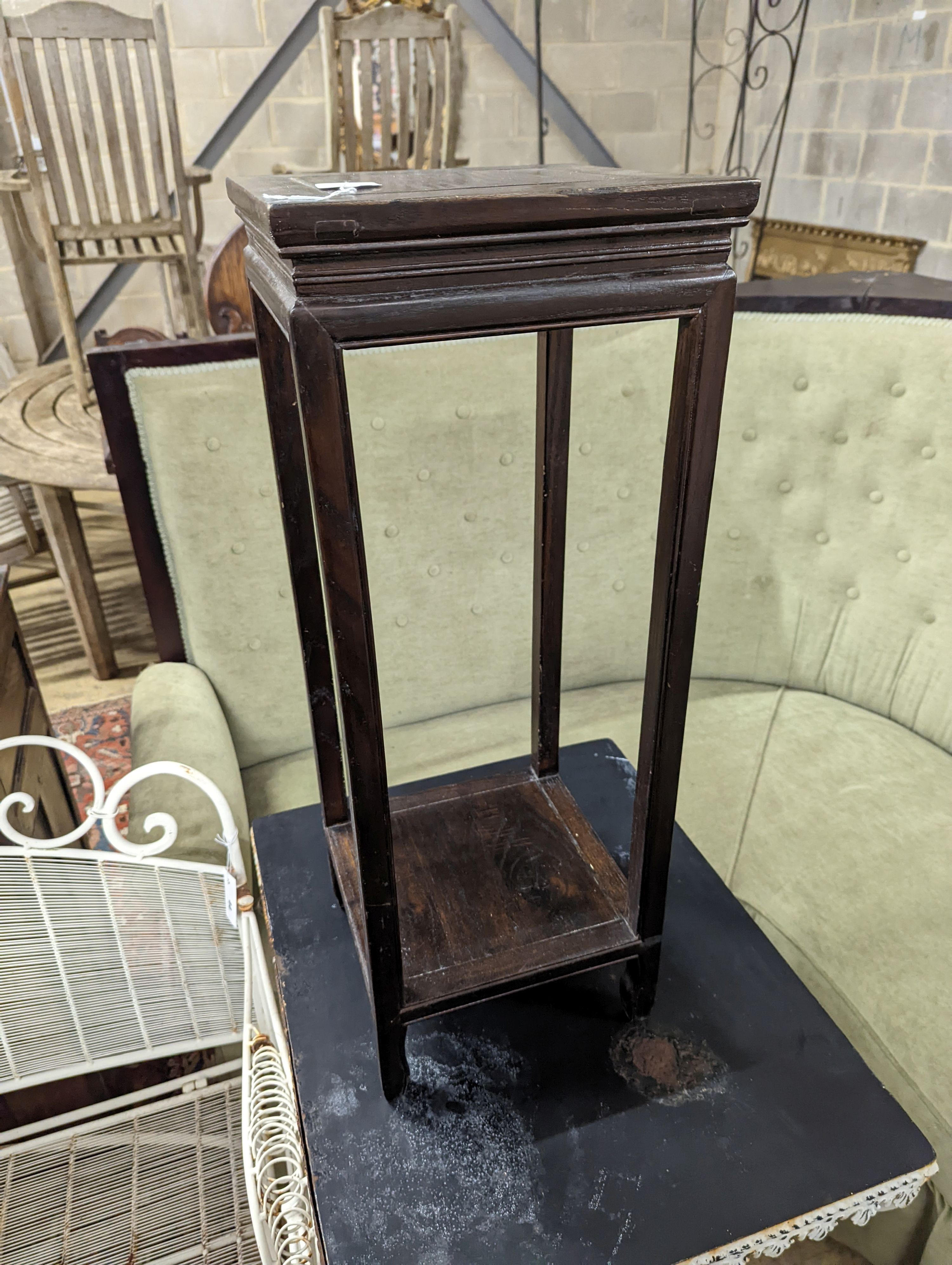 A Chinese elm two tier vase stand, width 28cm, depth 28cm, height 74cm